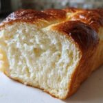 A close-up view showing the incredibly soft, fluffy interior crumb of a freshly baked loaf of milk bread.