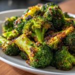 Close-up of vibrant green broccoli florets perfectly roasted and coated in a savory glaze for Honey Mustard Roasted Broccoli.